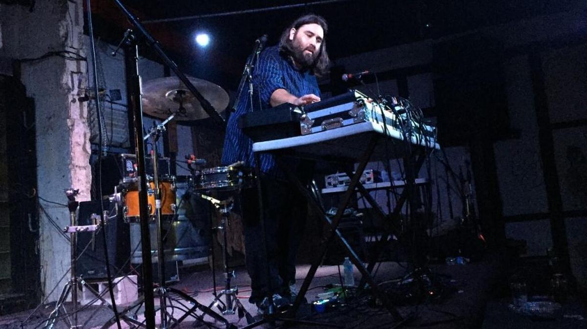 The Velocity Gospel, a one-man band featuring Emmanuel Canete, performs.