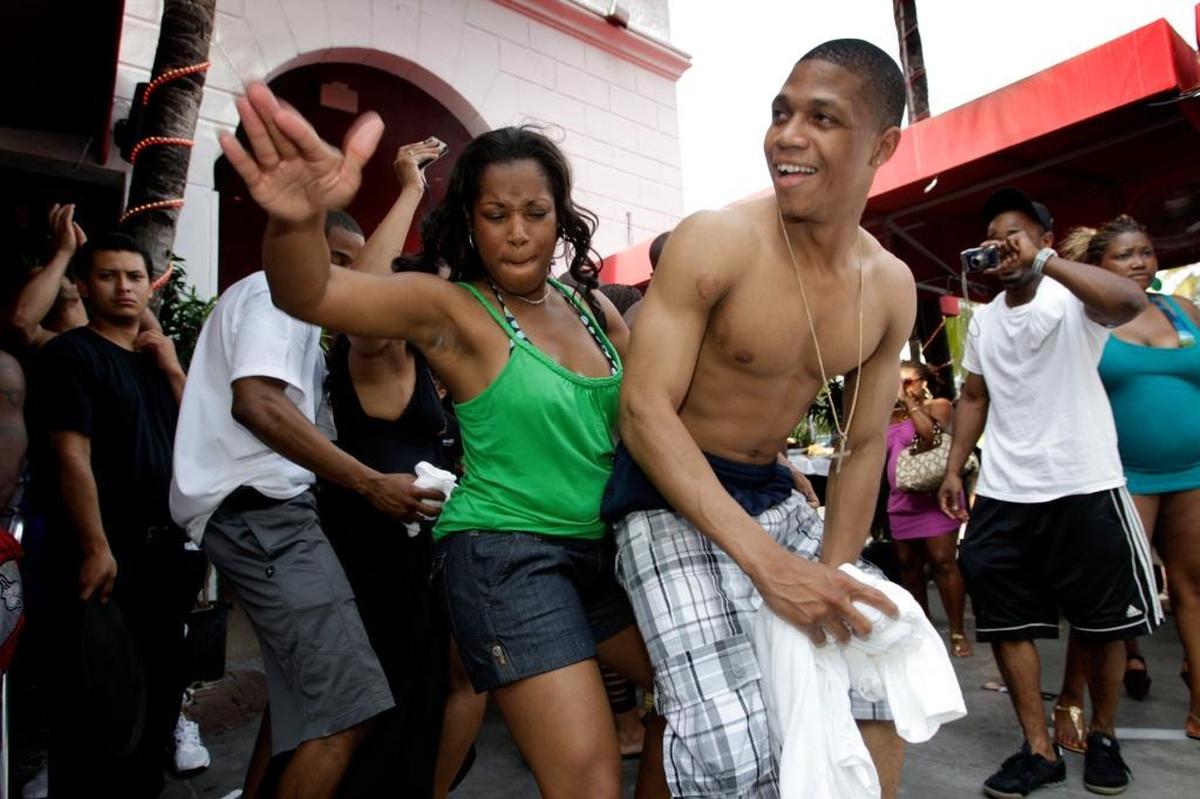 Tennile Wilson and Darrell B. of Chicago dance at Ocean's 10 during Urban Beach Weekend on Miami Beach in this 2009 file photo.