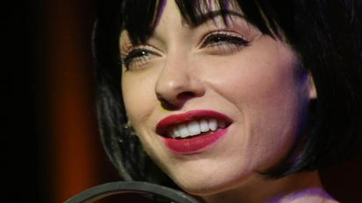
As Sally Bowles, Katherine Amadeo steps up to the microphone in Stage Door Theatre’s ‘Cabaret.’
