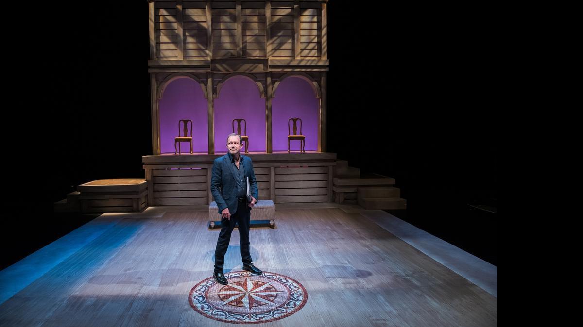 
Michael McKeever, standing on the set he designed for Zoetic Stage’s ‘Betrayal,’ is appearing in ‘The Book Club Play’ at Actors’ Playhouse as he gets ready for the world premiere of his play ‘Daniel’s Husband’ at Island City Stage.
