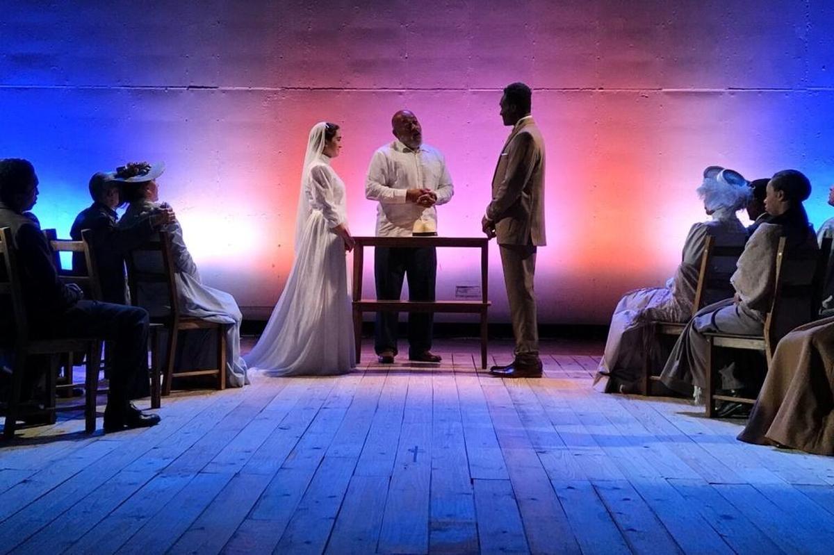 Thallis Santesteban as Emily and Martin K. Lewis as George are wed by Keith Randolph Smith’s Stage Manager in “Our Town.”