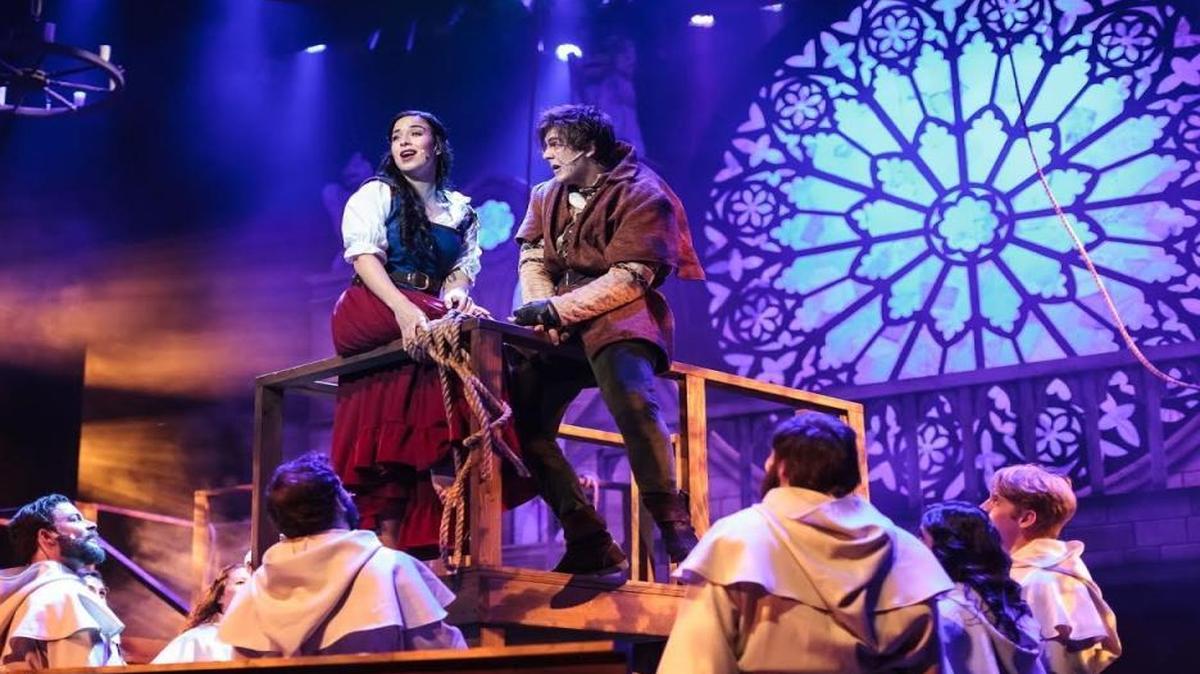 Shenise Nuñez as Esmeralda and Bobby Cassell as Quasimodo look out over Paris in Slow Burn Theatre’s ‘The Hunchback of Notre Dame.’