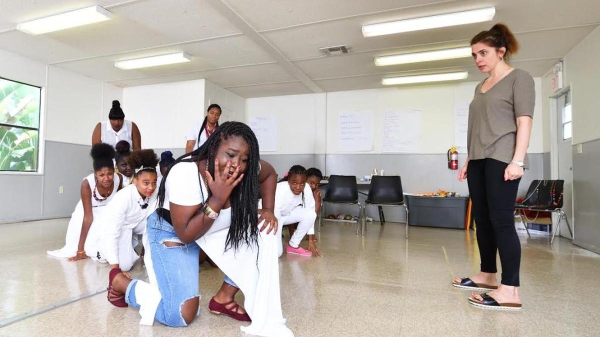 Brianne Cidel (front) and her fellow cast members take direction from Tea Alagić as they rehearse ‘YALS Antigone.’