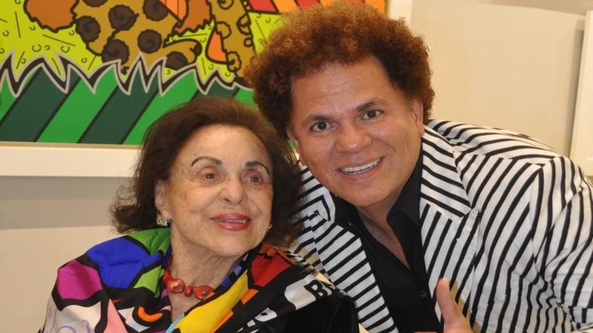 Legendary Miami Beach impresaria Judy Drucker and artist Romero Britto on Dec. 20, 2016, at Britto Central gallery on Lincoln Road. Britto painted a pop portrait of Drucker in tribute.