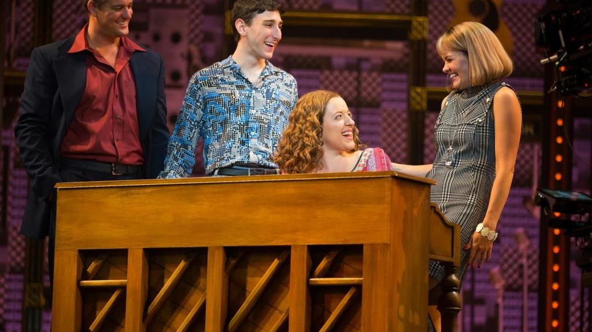 In the ‘You’ve Got a Friend’ scene from ‘Beautiful — The Carole King Musical’ Aldon Music staffers share a songwriting moment. (L to R) Curt Bouril (“Don Kirshner”), Ben Fankhauser (“Barry Mann”), Abby Mueller (“Carole King”) and Becky Gulsvig (“Cynthia Weil”).