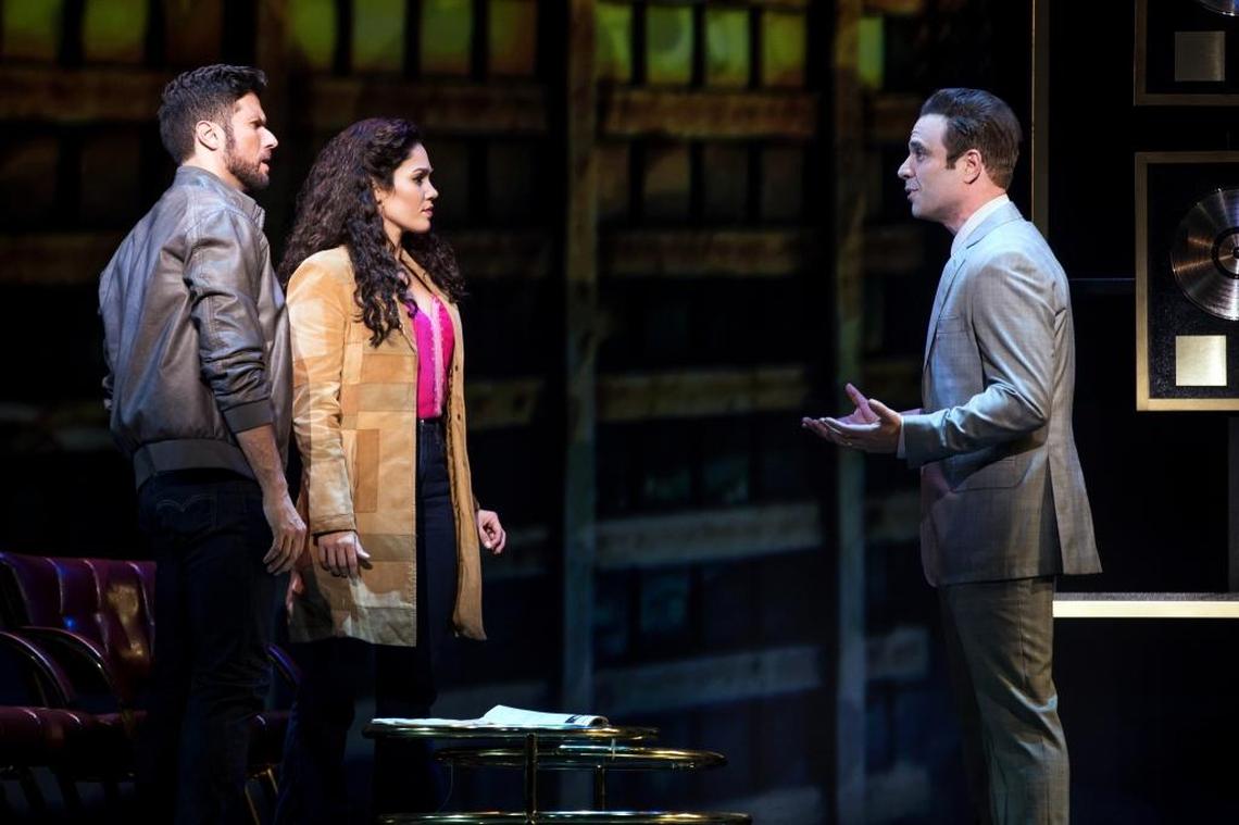Mauricio Martinez as Emilio Estefan and Christie Prades have a frustrating encounter with Devon Goffman as a record company executive in “On Your Feet!”