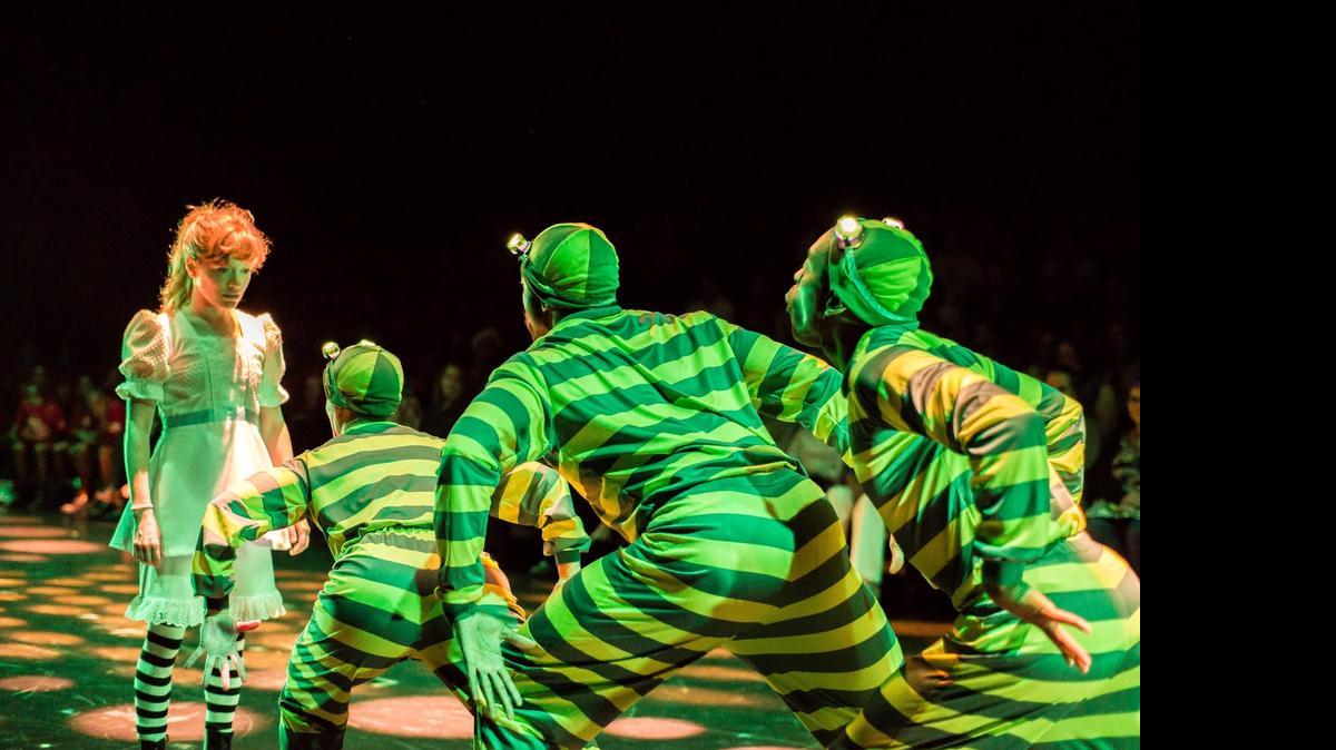 
Lindsey Noel Whiting’s Alice is confronted by a caterpillar in ‘Lookingglass Alice’ at Miami’s Arsht Center.
