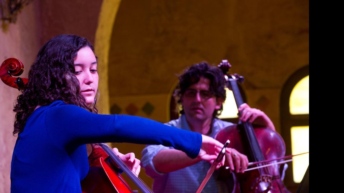 
Sara Mirabal, 16, of Palmetto Bay, demonstrates her playing technique for cellist Amit Peled during a Young Musicians Summer Master Class June 19, 2015, at Coral Gables Congregational United Church of Christ in Coral Gables.
