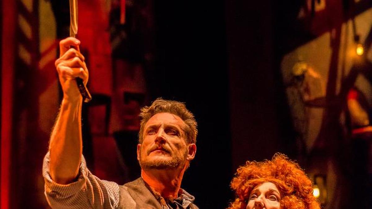 Aloysius Gigl’s Sweeney Todd is out for blood, with the encouragement of Jeni Hacker’s Mrs. Lovett, in Zoetic Stage’s ‘Sweeney Todd.’