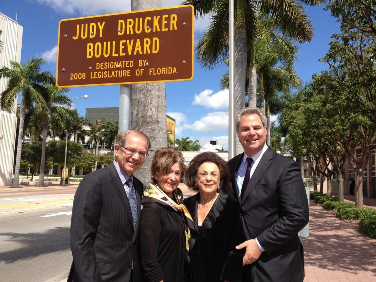 Adrienne Arsht Center board member Mike Eidson, philanthropist Sue Miller, Judy Drucker and Arsht Center President & CEO John Richard at the official dedication of “Judy Drucker Boulevard” outside the performing arts center in 2012.