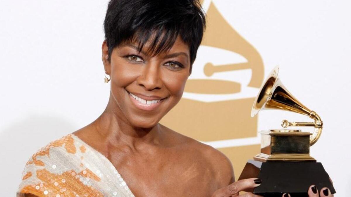 Natalie Cole holds the best instrumental arrangement accompanying vocalist award backstage at the 51st Annual Grammy Awards in Los Angeles in this Feb. 8, 2009 file photo.
