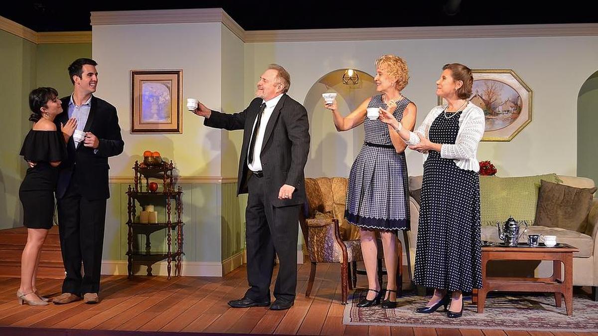 Newly engaged Isidora Miranda and Daniel Llaca get a welcome-home toast from Peter Librach, Lory Reyes and Francine Birns in Michael McKeever’s ‘37 Postcards.’