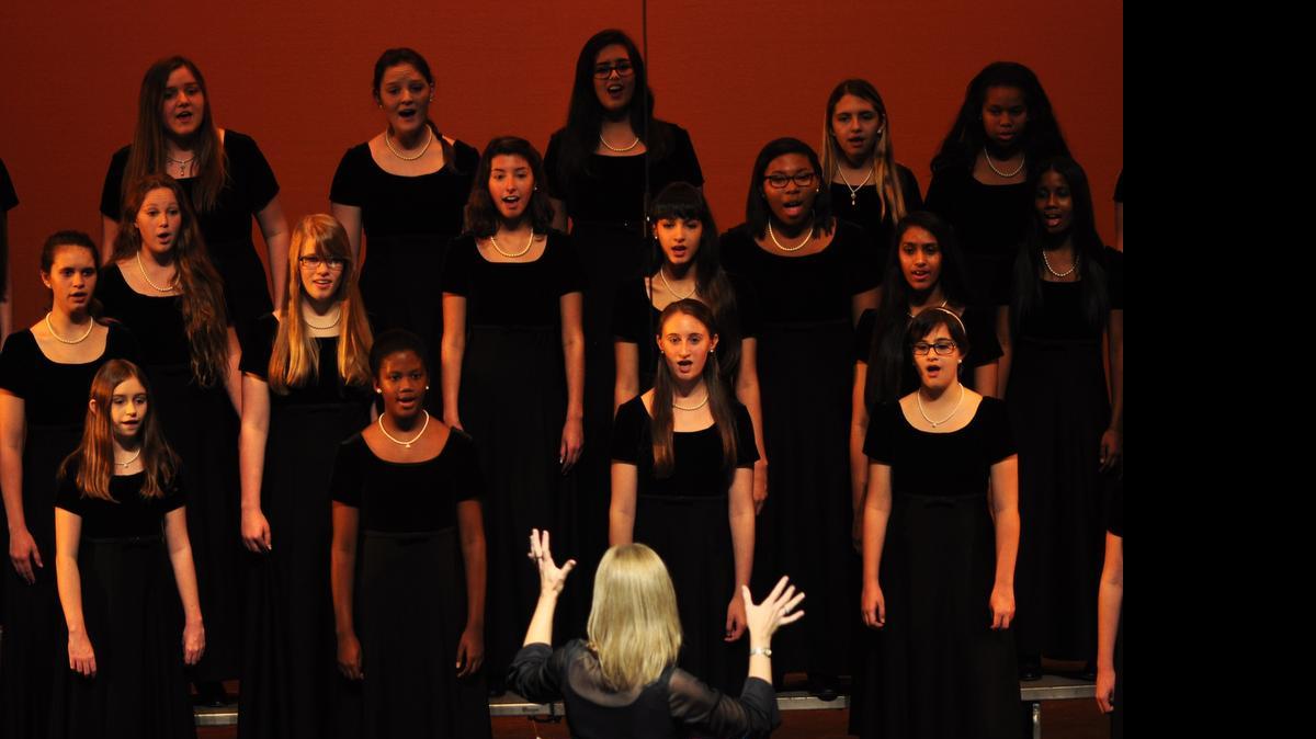 
Wallis Peterson conducts the Girl Choir of South Florida, which will sing at London’s Canterbury Cathedral.
