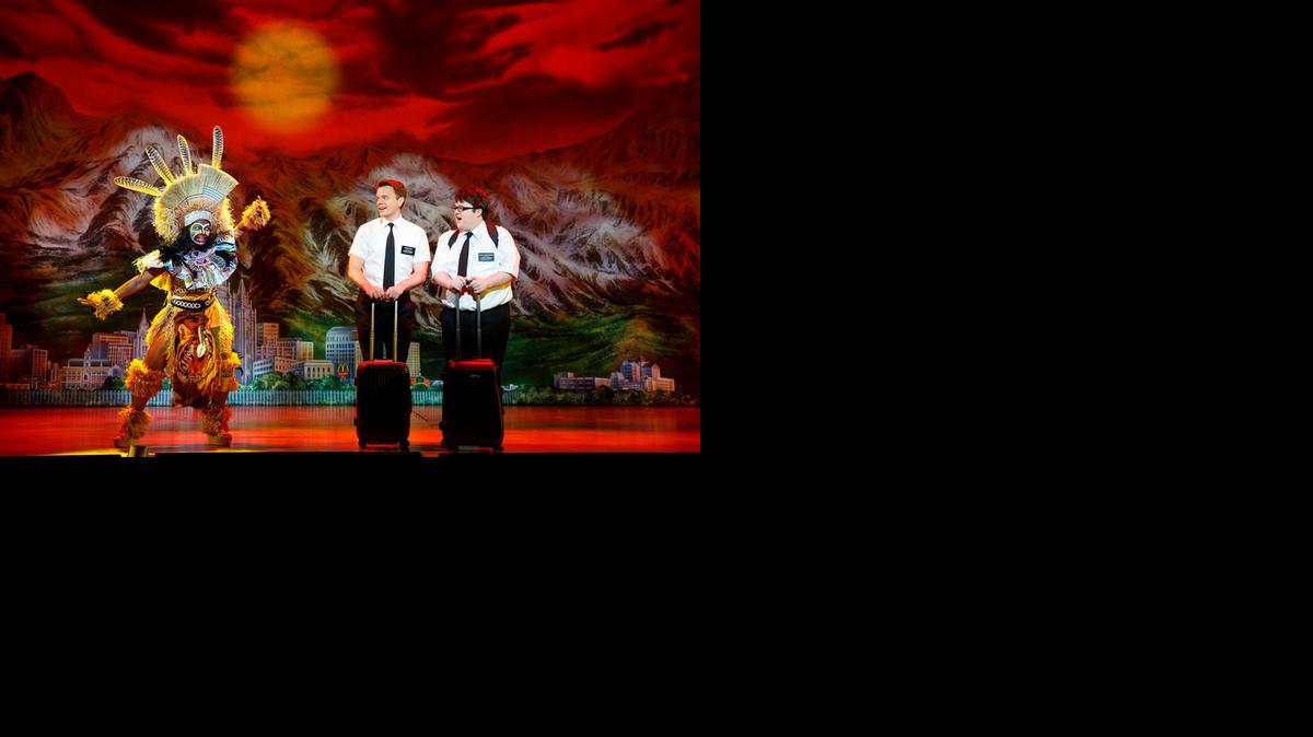 
Monica L. Patton sings to newly arrived missionaries David Larsen and Cody Jamison Strand in ‘The Book of Mormon’ at the Arsht Center.
