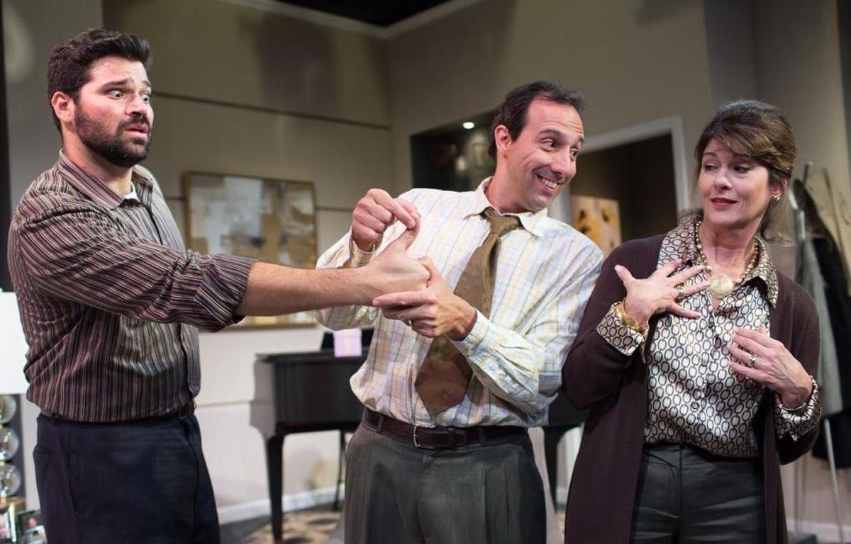 Theodore (John Manzelli, center) tells his mother-in-law (Patti Gardner) that he admires the hands of Pablo (Alex Alvarez, at left).