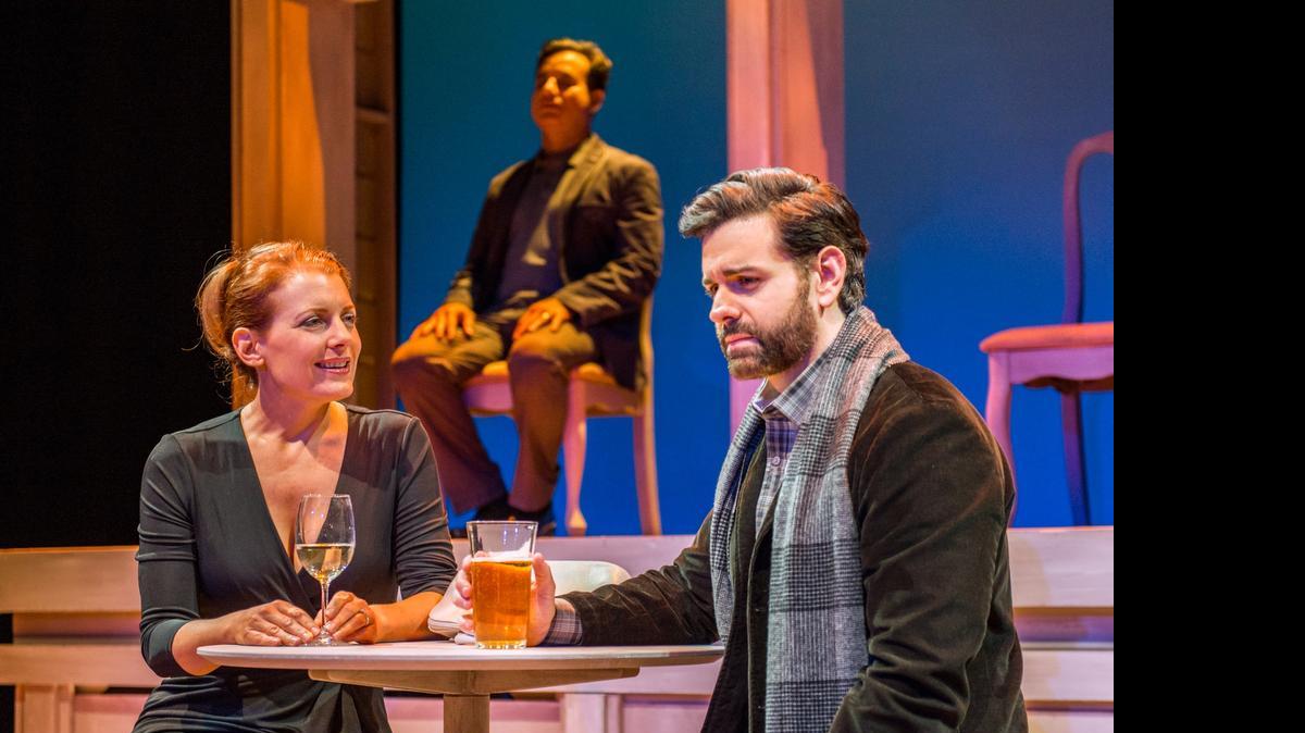 
Amy McKenna and Nicholas Richberg catch up as Chaz Mena sits silent in Zoetic Stage’s ‘Betrayal’ at the Arsht Center.
