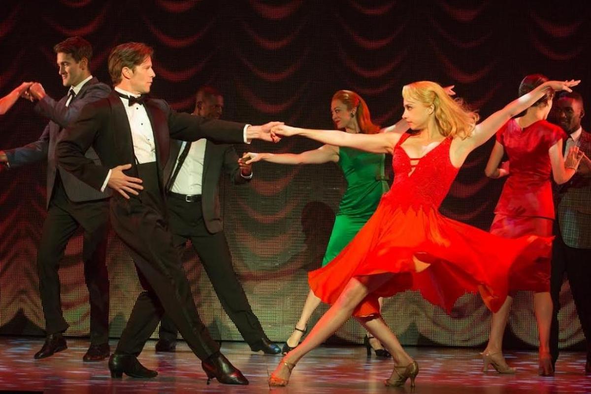 Johnny Castle (Christopher Tierney) and his partner Penny (Jenny Winton) show the tourists how it’s done in ‘Dirty Dancing.’