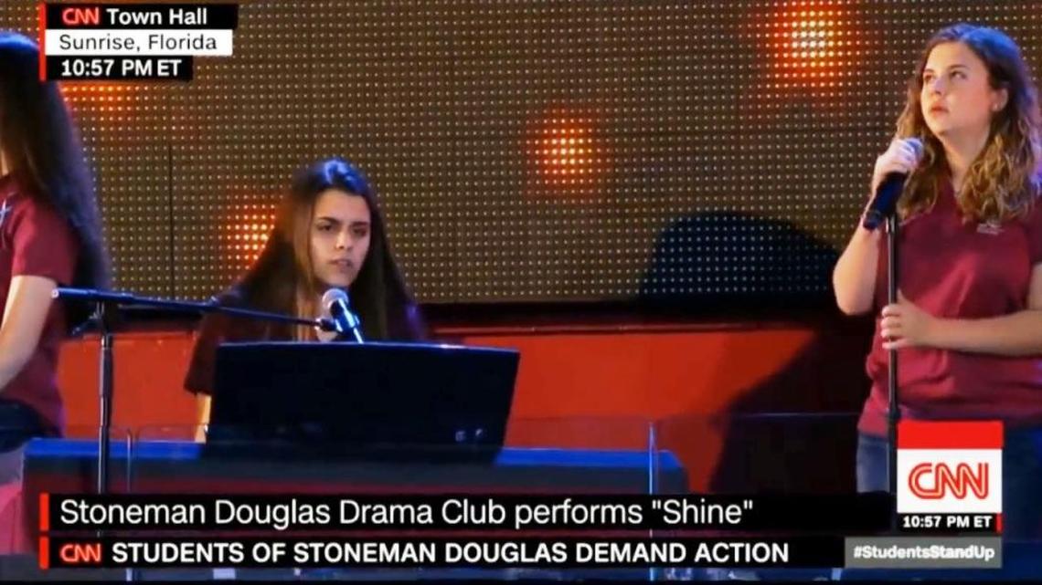 Marjory Stoneman Douglas drama students Andrea Peña (at the piano) and Sawyer Garrity (singing) perform their song ‘Shine’ at the CNN Town Hall on Feb. 21, 2018.