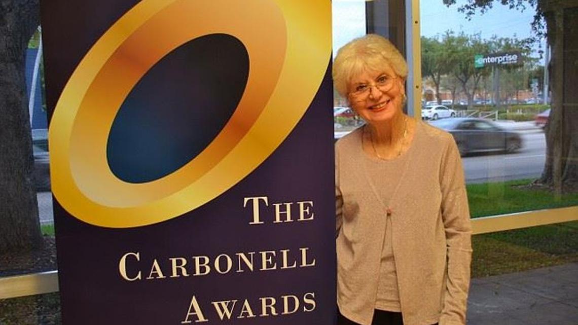 
Iris Acker, standing outside ArtServe for a Carbonell Awards reception, received the Howard Kleinberg Award for her contributions to the South Florida Arts scene.

