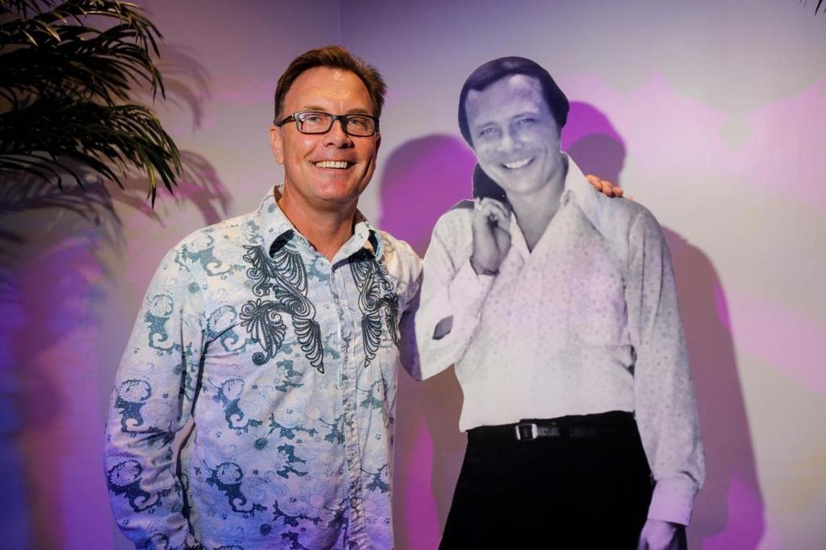 Rick Shaw's son Sean Hummel stands next to a cardboard cutout of his late father on Sunday, Oct. 22, 2017 at the Gulfstream Park.