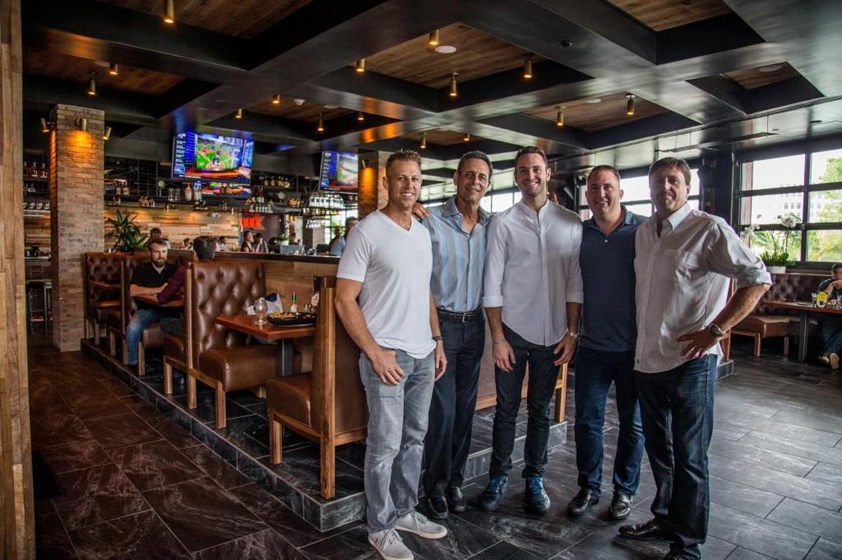 From left: Andrew Balick, culinary director; Douglas Rudolph, president; Alex Rudolph, vice president of development; Andy Yeager, chief operating officer, and Blaise McMackin, vice-president of design, are five of the six partners of Tapco, the restaurant chain behind Tap 42 Craft Kitchen and Bar.