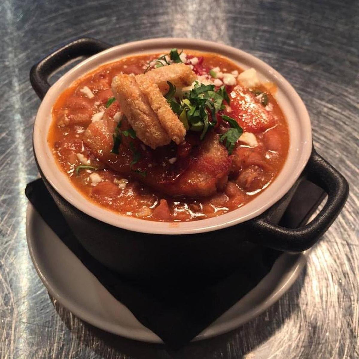 The charros olla combines meaty pork belly and cowboy beans in a sauce heightened with pasilla Oaxaca chile to make for a hearty and satisfying dish.
