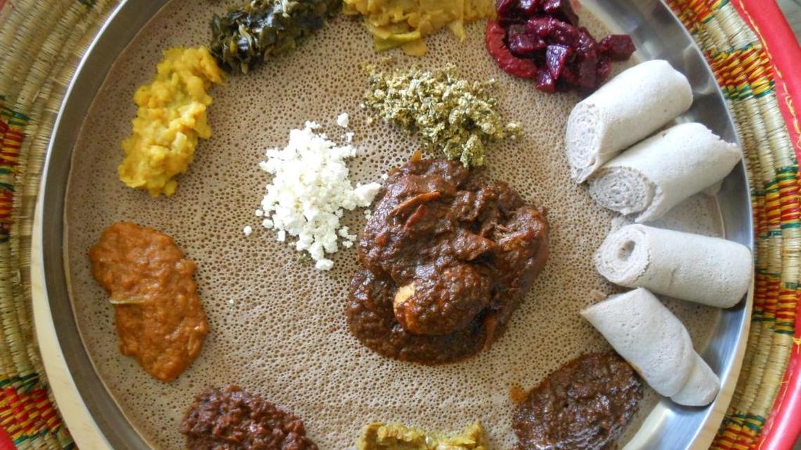 Combination injera platter with wats.