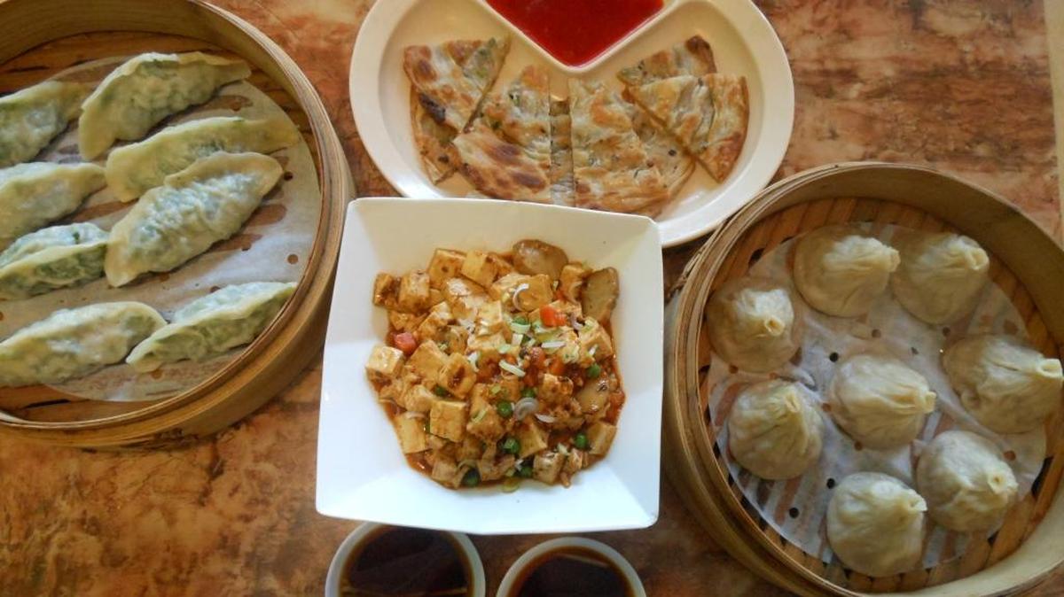 Bok choy dumplings, scallion pancakes, mapo tofu and soup dumplings at Dumpling King, North Miami Beach.