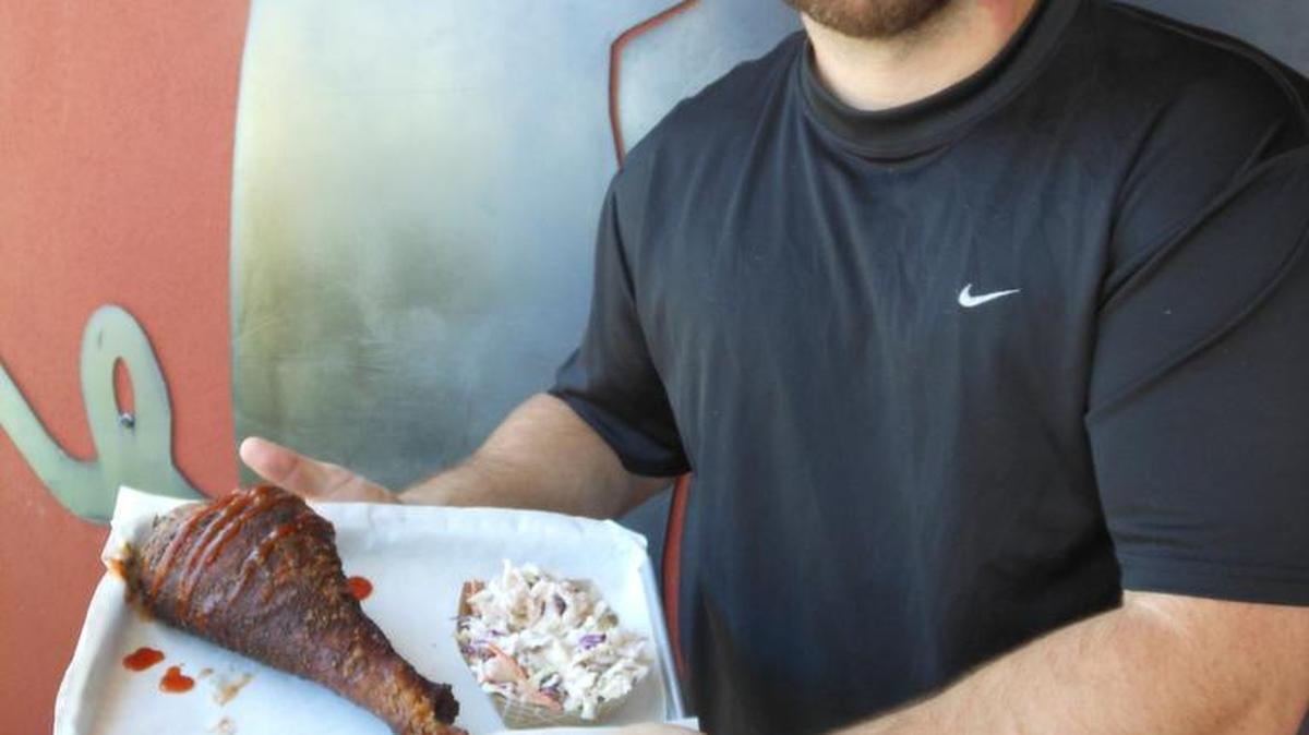 Owner Craig Young in front of Burning Oak BBQ.