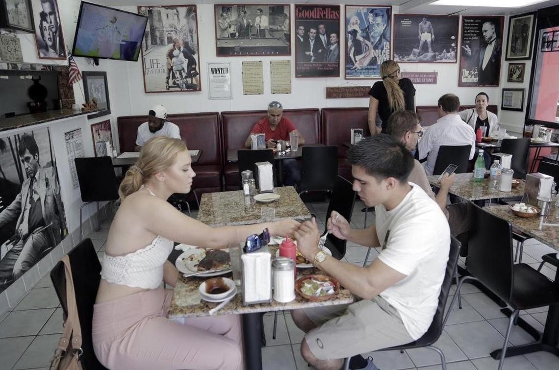 Customers enjoy lunch at the S&S Diner's new location. The restaurant's longtime manager, Maria Linares, worked with the previous owner Simon Elbaz, to reopen the restaurant and they brought along their time capsule of photos, movie posters and quirky signs.