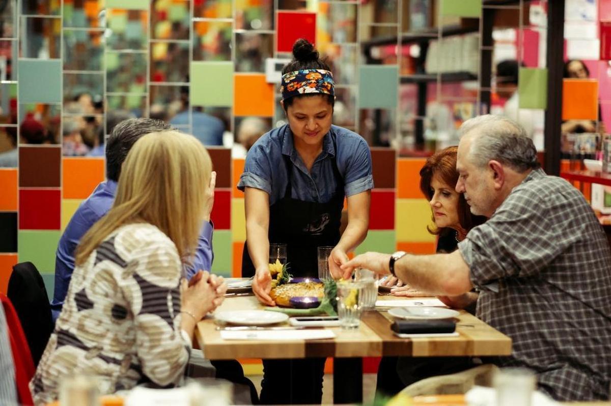 Dizengoff chef Valerie Chang serves Shabbat dinner during a recent event with Mandolin Aegean Bistro chef Roel Alcudia that centered on Mediterranean cuisine.