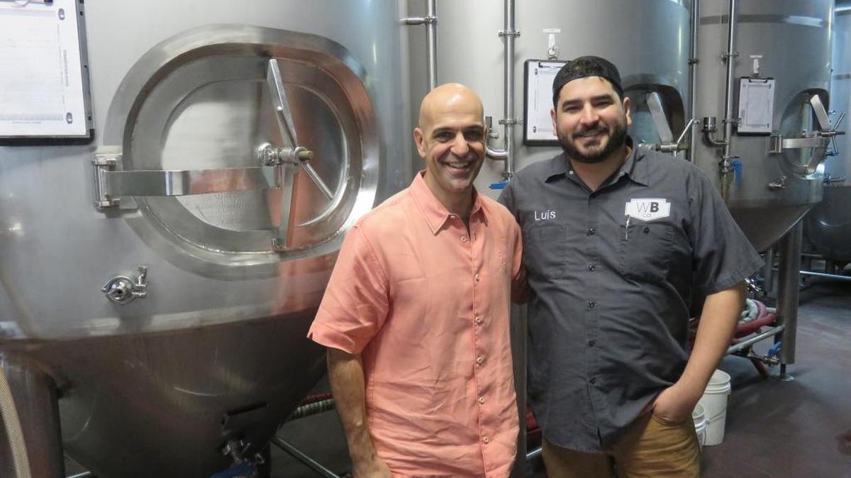 Andy Thomas (left), CEO of Craft Brew Alliance, has teamed up with Wynwood Brewing’s Luis Brignoni to help the Miami-based brewery make enough beer to meet their local demand.