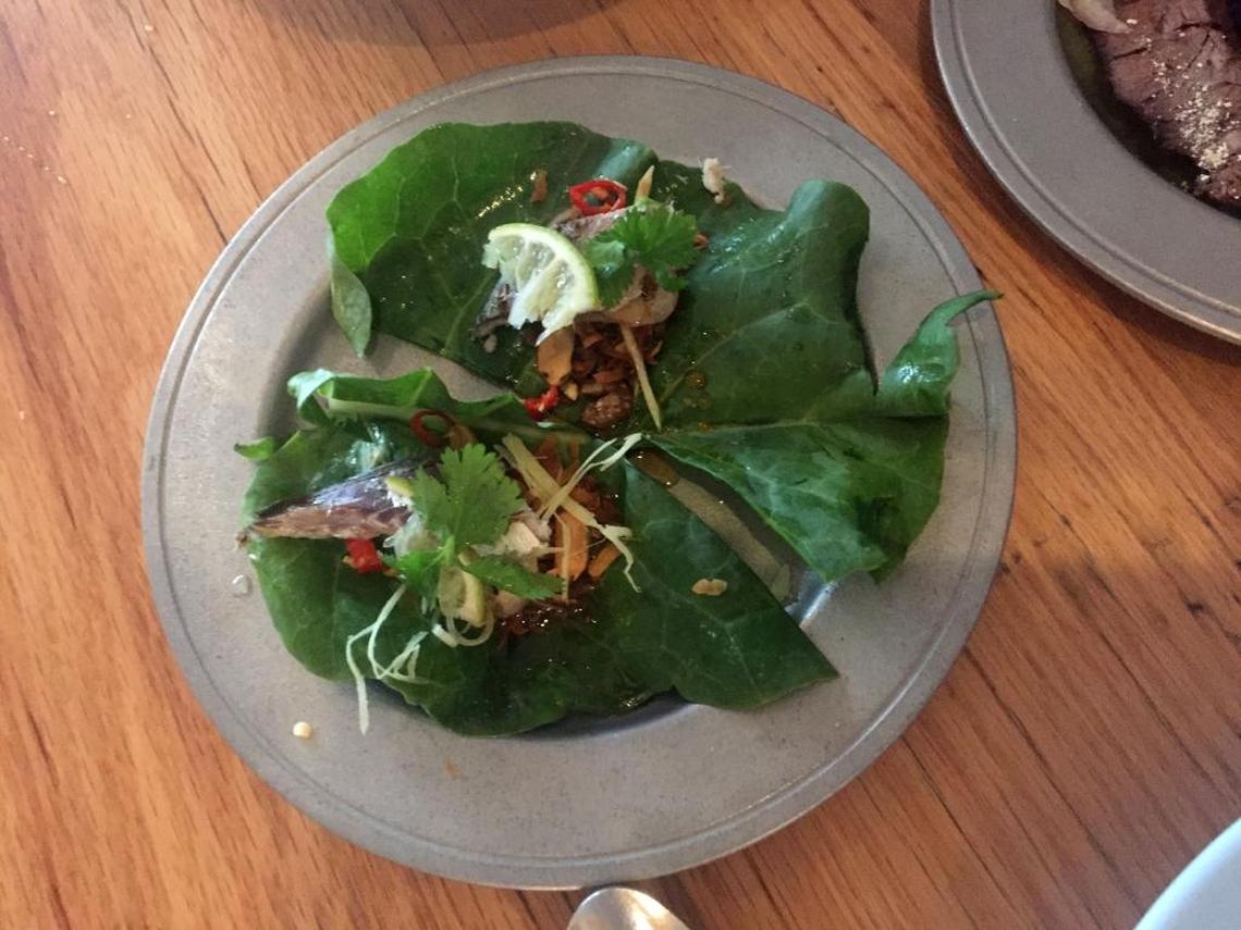 Miang Kana Platoo grilled Florida mackerel in Chinese broccoli leaf wraps at Cake Thai.
