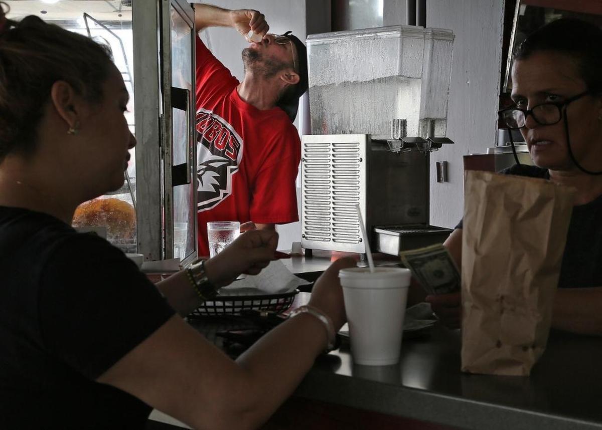 Jake Katel finishes his Cuban coffee at La Palma, one of his favorite "ventanitas,” which has been open since 1979.