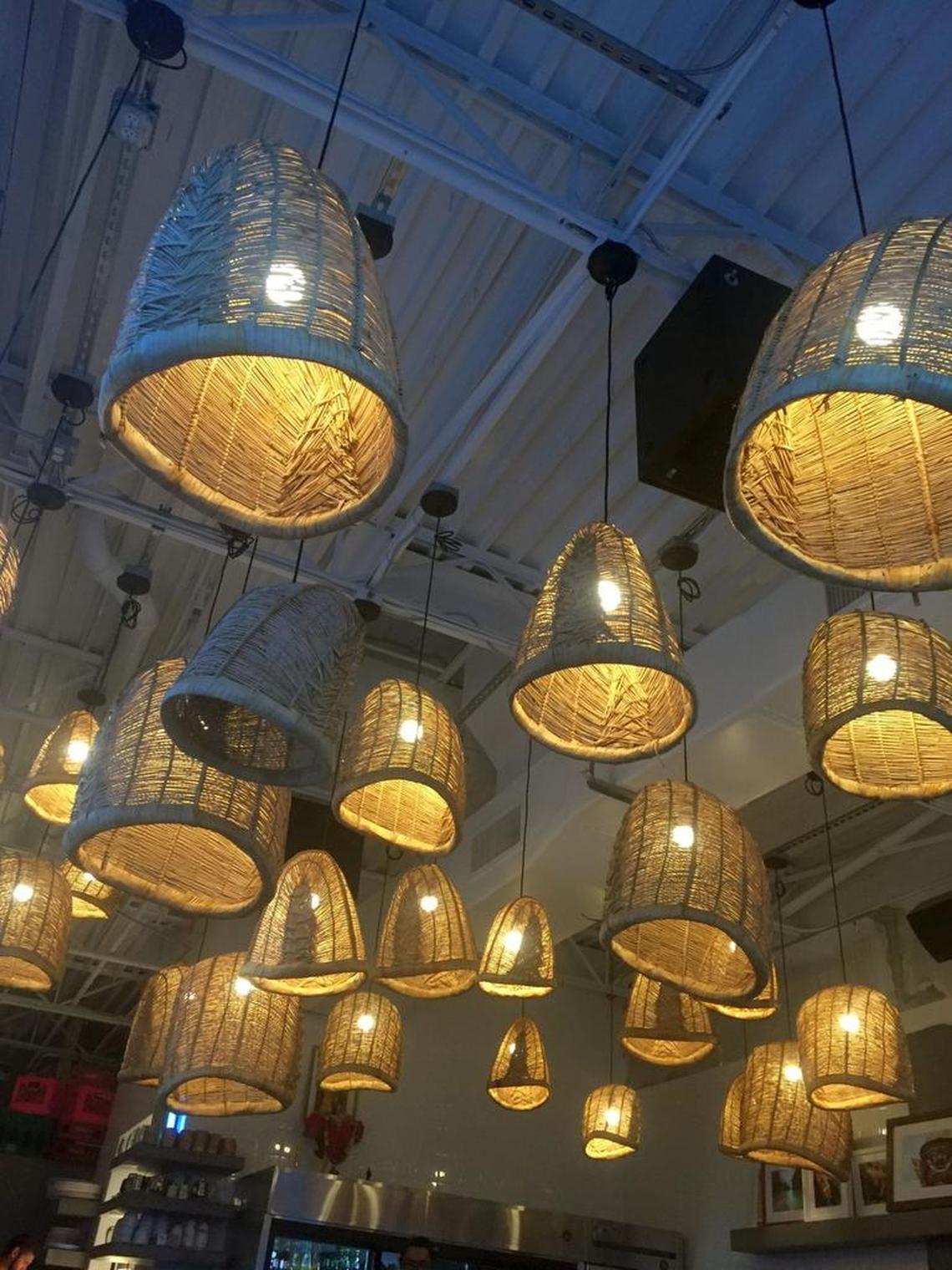 When the evening sun dips and the ceiling lights filter through a sea of upended woven baskets overhead, the 30-seat dining room at Cake Thai gets downright magical.