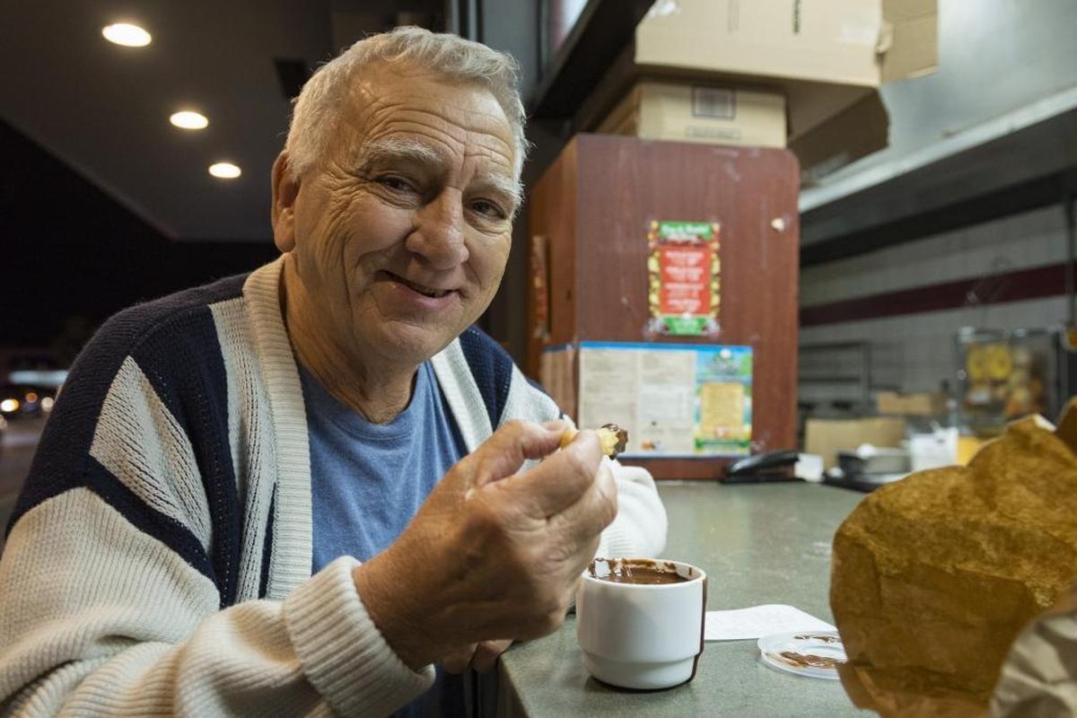 Gabriel Peña poses for a photo before eating a churro at La Palma Restaurant on January 3, 2018. It was Peña’s first time at La Palma for churros.