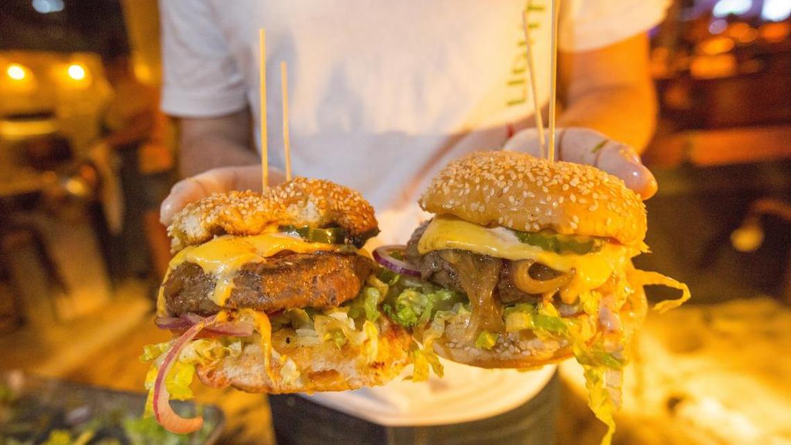 Two Miami burgers were chosen among the best burgers in the country at the 2018 South Beach Wine & Food Festival’s Burger Bash in Miami Beach. Here, Charm City Burger Company from Deerfield Beach shows off its entry