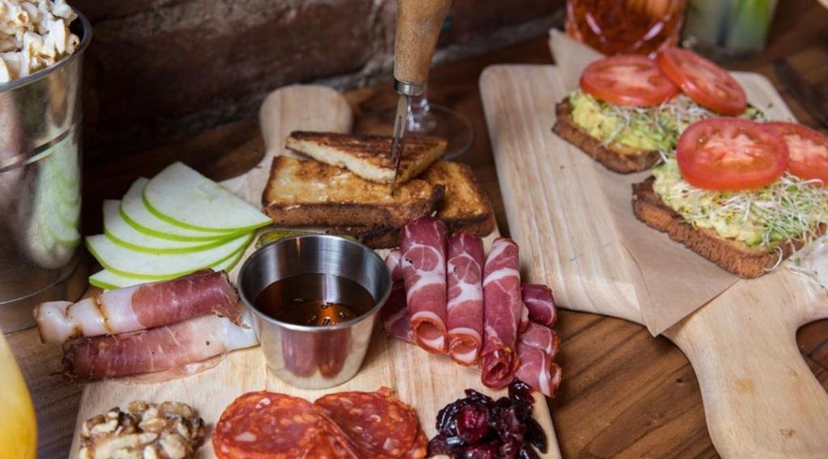 A charcuterie board with coppa, speck ham and salami and choices of cheeses with toasted sourdough bread and cornichons are a good starter at The Craftsman.
