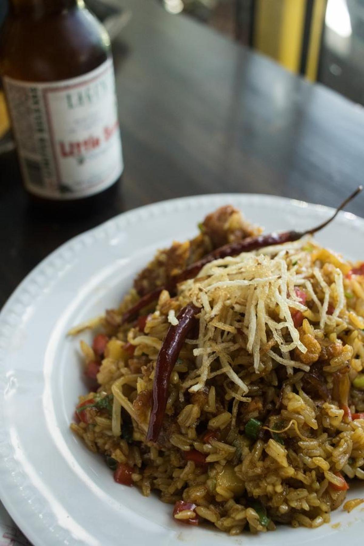 Amelia 1931’s General Tso’s alligator fried rice brings together Asian and Floridan flavors.