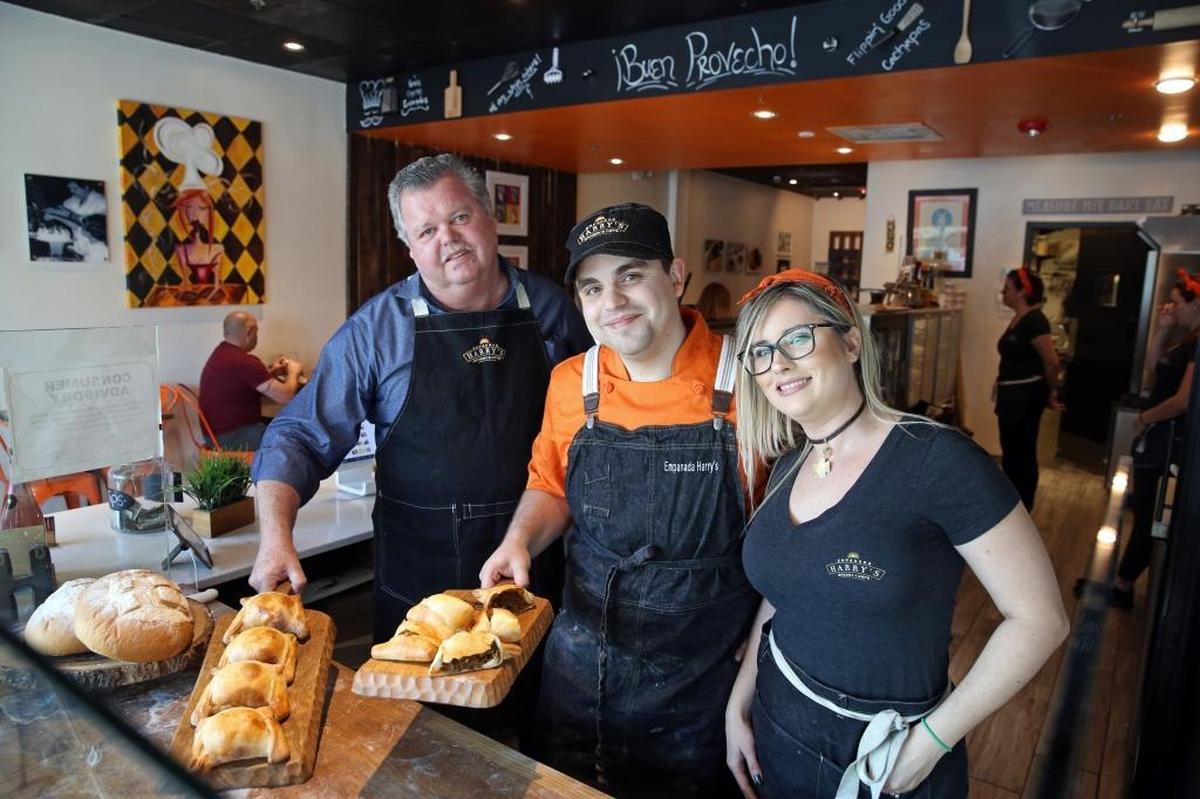 Empanada Harry’s in the days before the coronavirus. Since then, Harry Coleman, center, and his wife, Michelle, pictured with Harry’s father, Philip, have required staff to get the coronavirus vaccine.