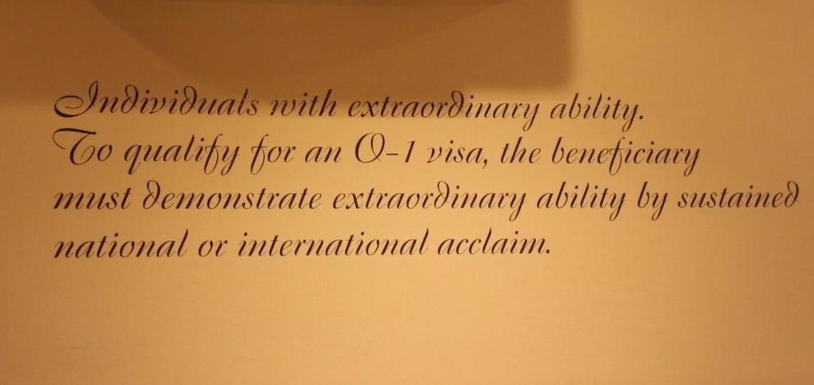 A description of the U.S. O-1 visa is printed on the wall of chef and co-owner Renato Viola’s Miami Beach pizzeria, Mister O-1.