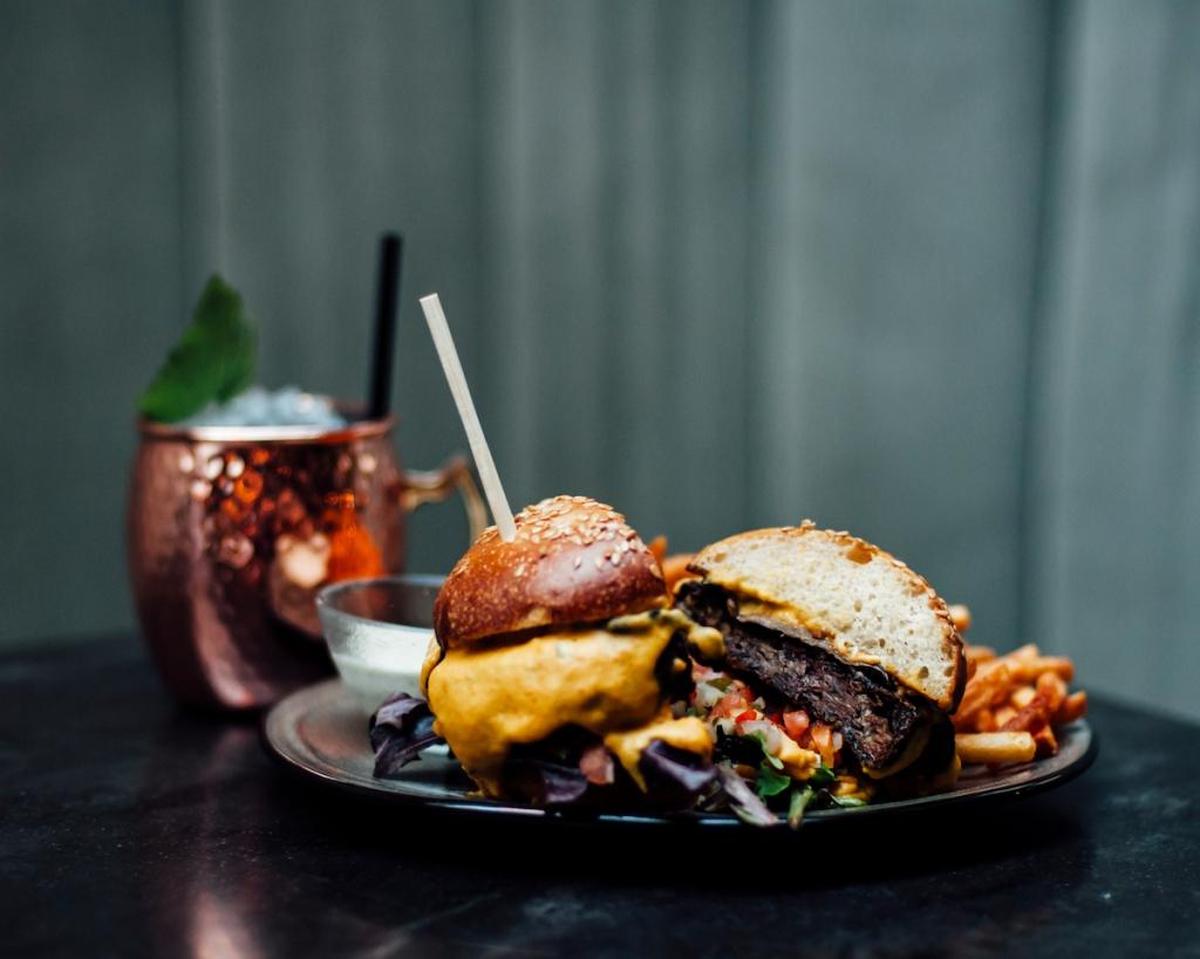 The burger at Planta is a hefty patty made of black beans, mashed lentils and beetroot.