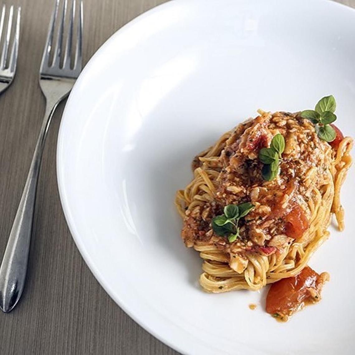 A could-not-be-simpler housemade tagliolini is tossed with wild Alaskan crab meat, gorgeous cherry tomatoes from Homestead with a hit of spicy chili oil.