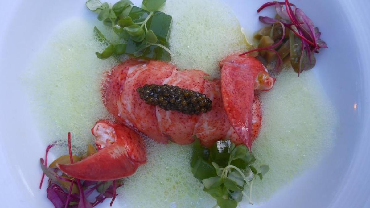 Poached Maine lobster with green pea foam, small cubes of spring onion gel and caviar at Gianni's Villa, Miami Beach.