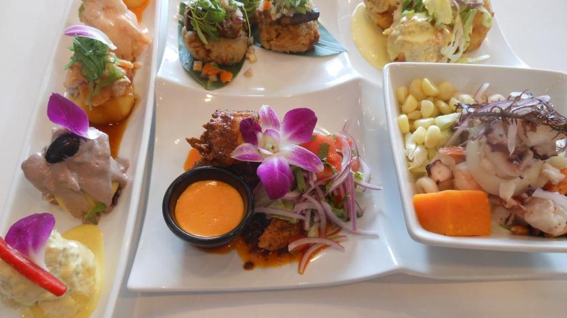 Causa sampler (far left), tacu tacu (bean and rice fritters), fried ceviche balls, mixed seafood ceviche and seared octopus at Dr. Limon in Kendall.