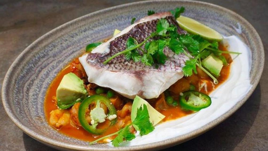 The snapper pozole filet at Sugarcane bathes nicely in a homemade fish and charred-vegetable stock. Balloo is renowned for crossing cultures in his cuisine.