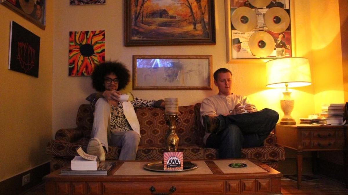 Danny Milotta, left, and Casey Connor on Monday, Jan. 25, in the living room area of The Awa Kava Lounge in Little Haiti.
