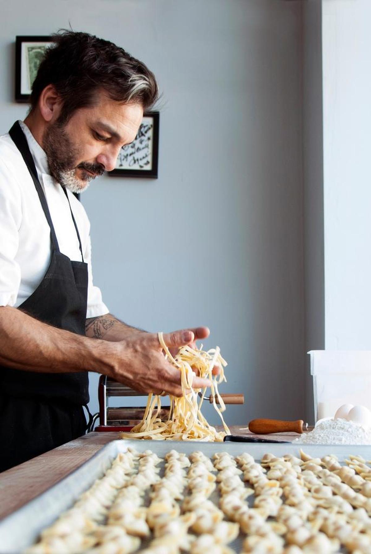 Chef Giancarlo “Wendy” Cacciatori can regularly be found making the pasta in the restaurant window of Via Emilia.