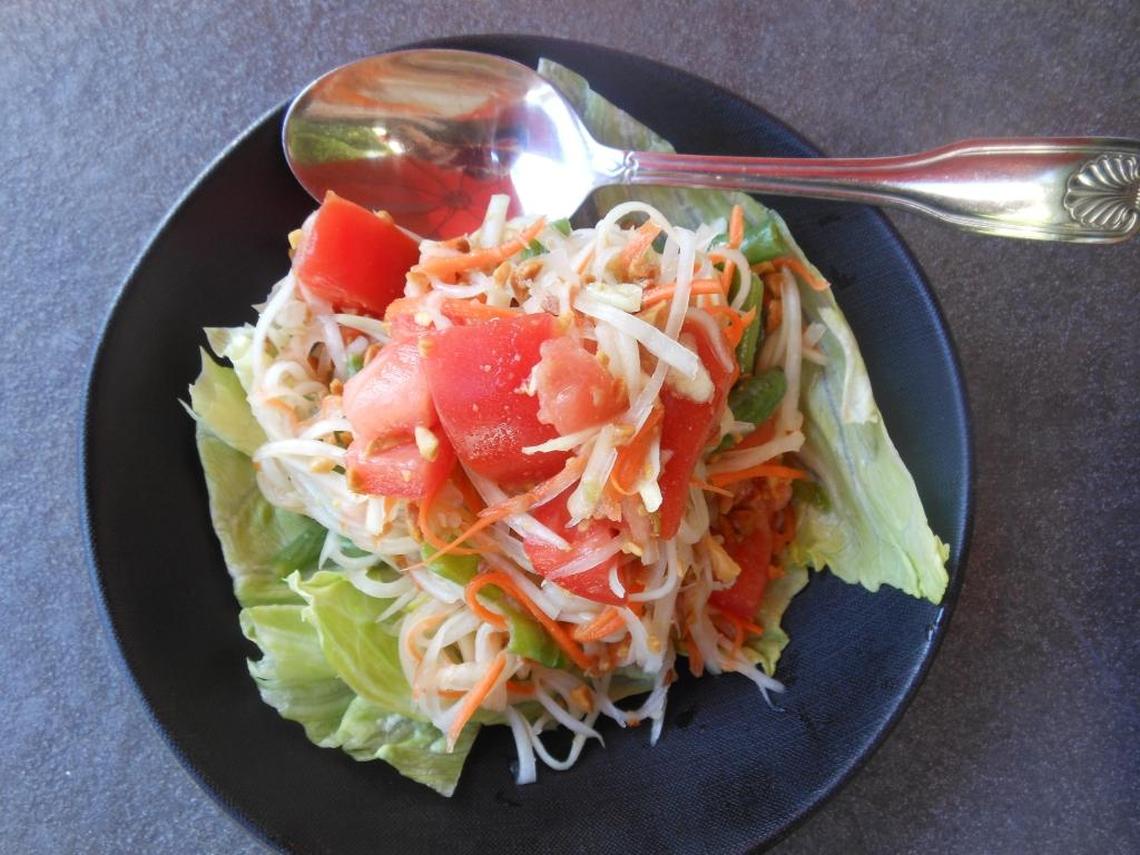 Green papaya salad with tomato, green beans and crushed peanuts at East Thai Noodle House.