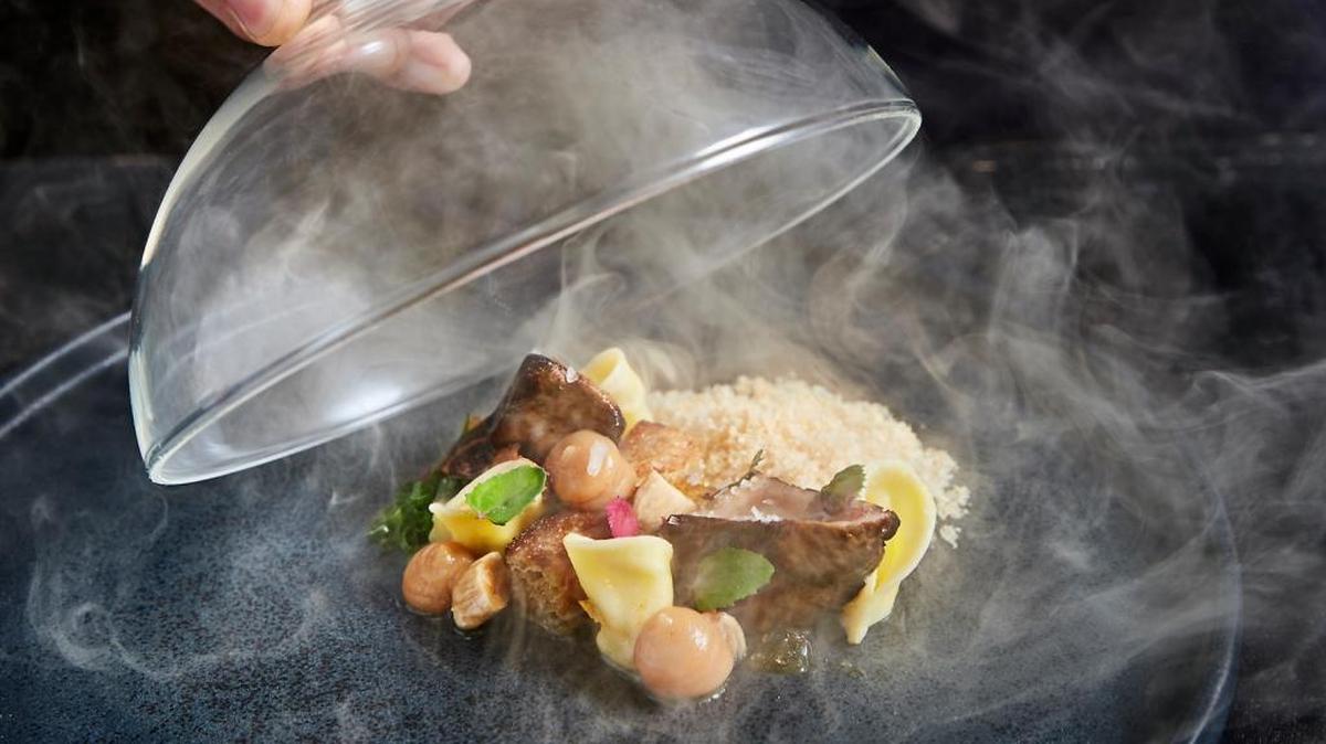 The flourishes with food work at Stubborn Seed, even when there are smokes and foams, such as this smoked foie gras under a glass cloche.